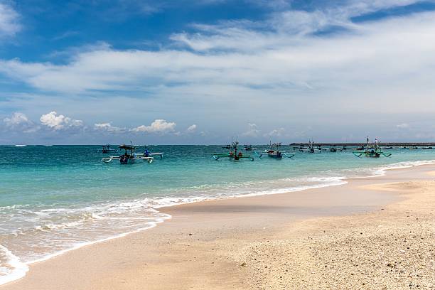 Kuta Beach is a sandy beach with ocean in Bali, Indonesia.