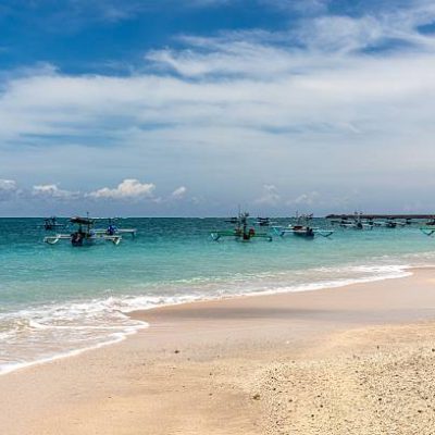 Kuta Beach is a sandy beach with ocean in Bali, Indonesia.