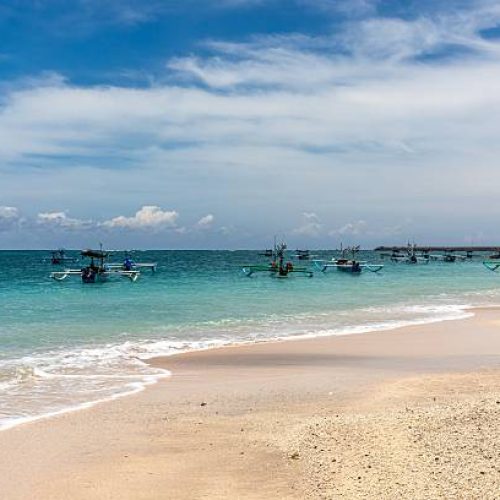Kuta Beach is a sandy beach with ocean in Bali, Indonesia.